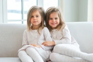 Twin girls on a couch